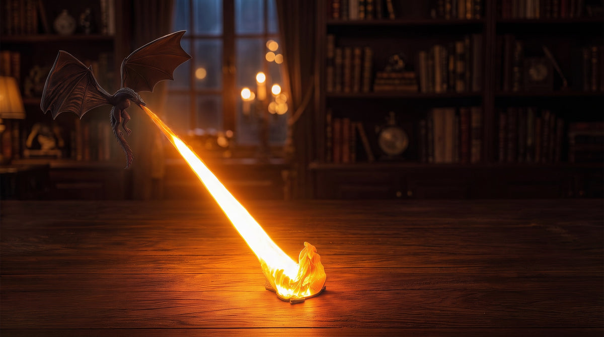Emberwing flying dragon lamp breathing an orange flame on a dark wooden desk